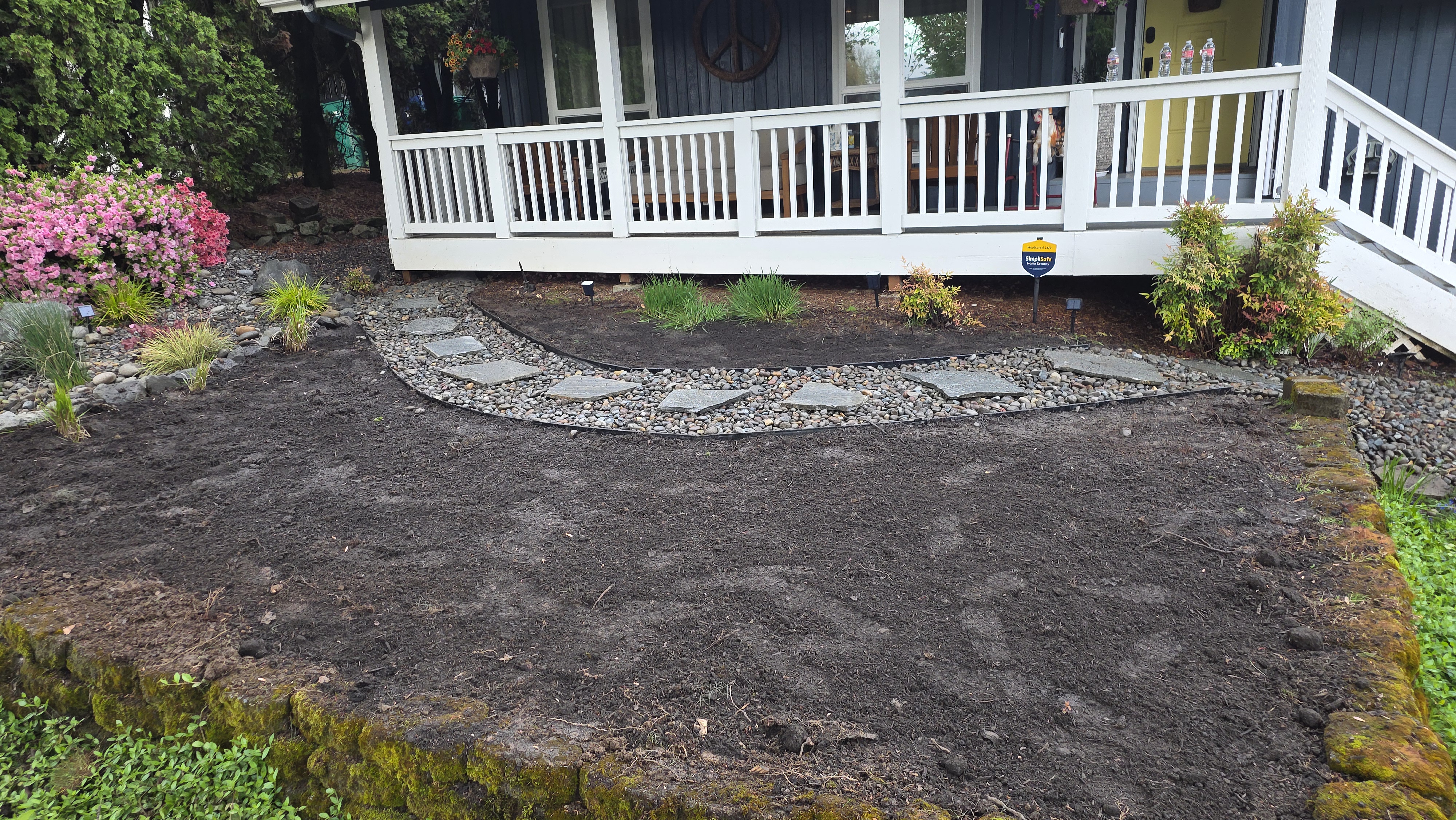 Landscape Renovation with River Rock and Flagstone path